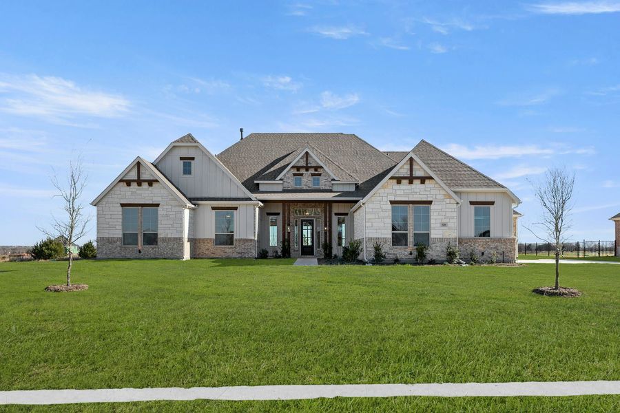 Front exterior of a home in the Heritage community, located in McLendon-Chisholm, TX (Image 10).