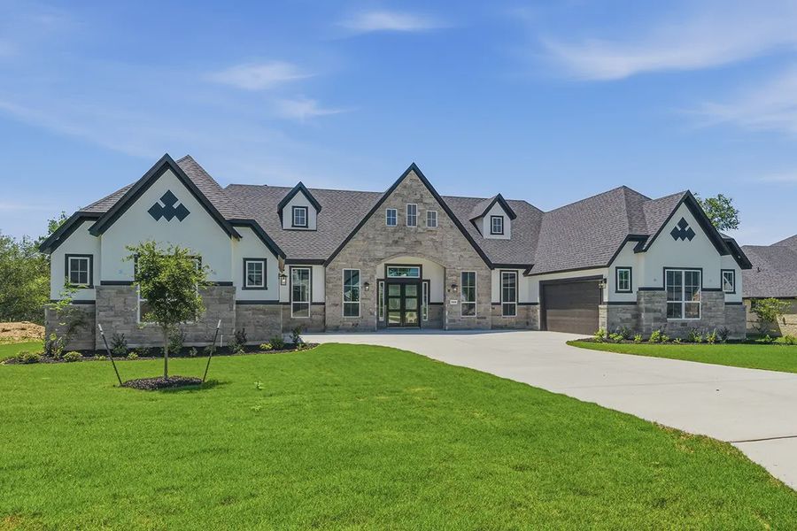 Front exterior of a home in the Grand Lakes Estates community, located in Montgomery, TX (Image 7).