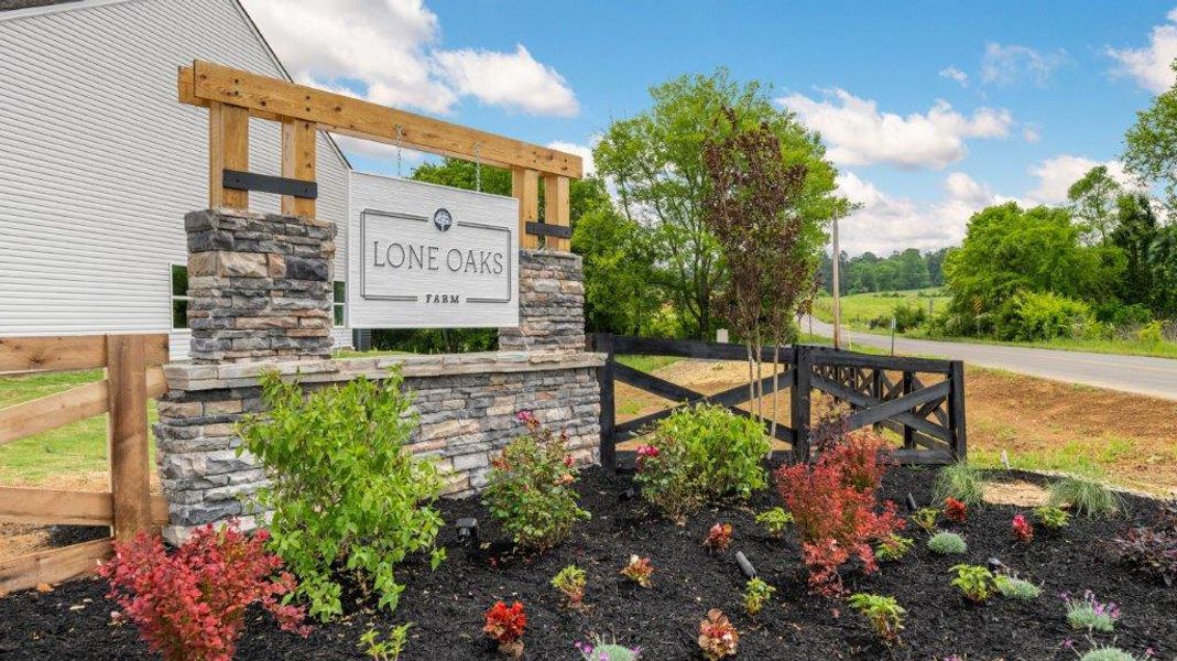 Entrance to the Lone Oaks Farm community in Cleveland, TN, featuring signage and landscaping (Image 2). Entrance to the Lone Oaks Farm community in Cleveland, TN, featuring signage and landscaping (Image 2).
