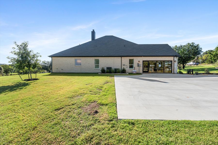 Front exterior of a home in the Oak Grove Addition community, located in Springtown, TX (Image 16).