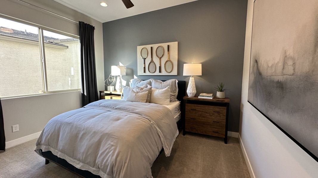 Furnished interior in a model home at CantaMia at Estrella 55+ in Goodyear (Image 31).