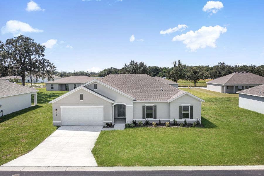 A house with a lawn and trees.