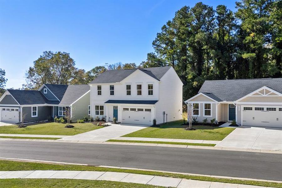 Front exterior of a home in the Sharron Creek Crossing community, located in Shallotte, NC (Image 3). Front exterior of a home in the Sharron Creek Crossing community, located in Shallotte, NC (Image 3).