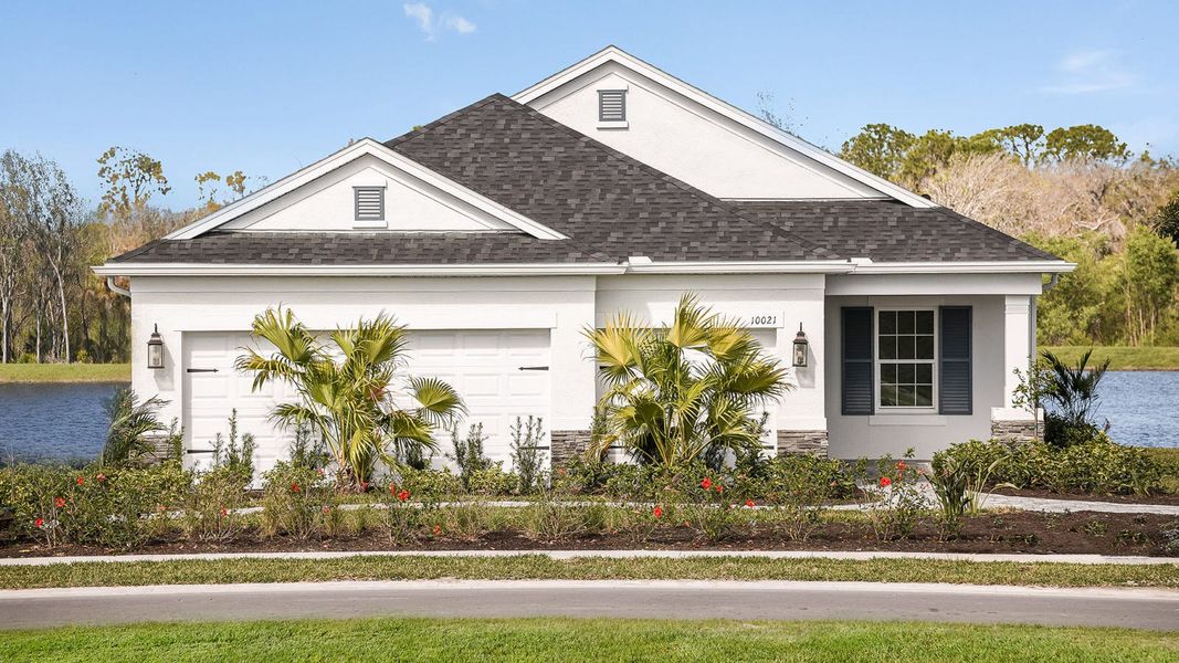 Front exterior of a home in the Wildleaf at North River Ranch community, located in Parrish, FL (Image 14).