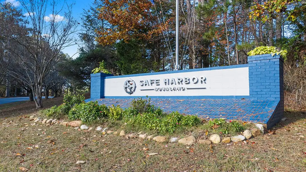 Entrance to the Waypoint community in Flowery Branch, GA, featuring signage and landscaping (Image 2).