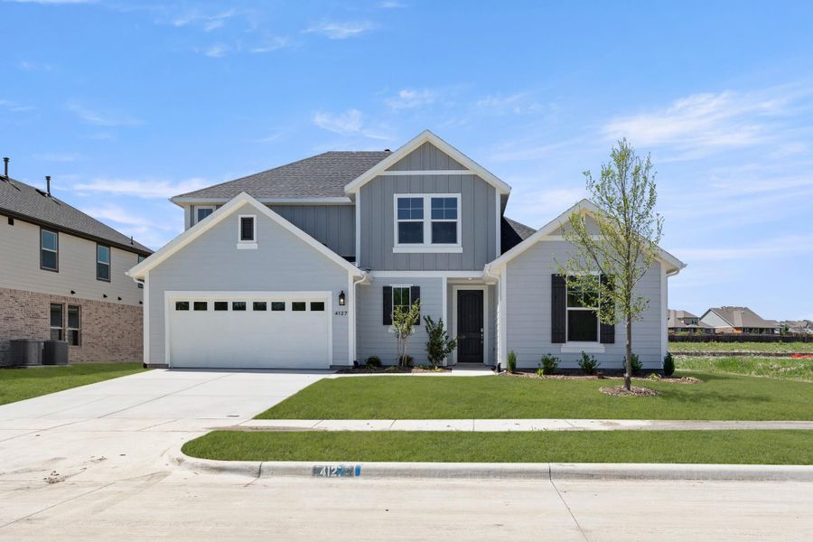 Front exterior of a home in the Somerset Park community, located in Rockwall, TX (Image 6).