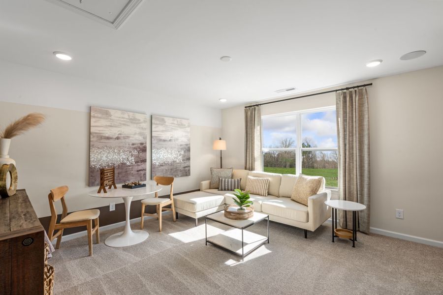 Furnished interior in a model home at Cardinal Landing in Coats (Image 6).