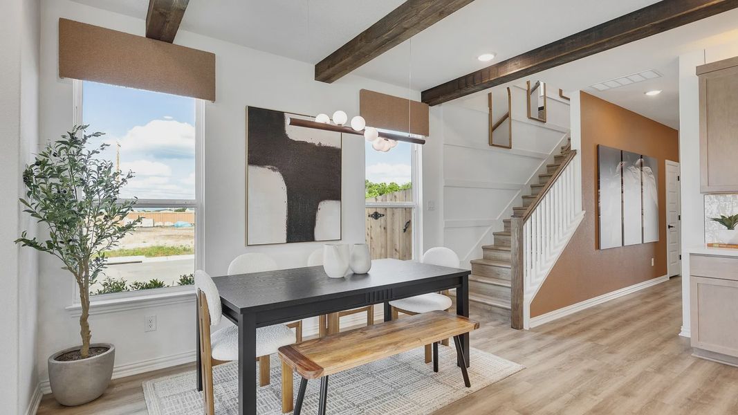 Experience elegance with exposed beams, rich wood flooring, and art accents in Spring Creek.