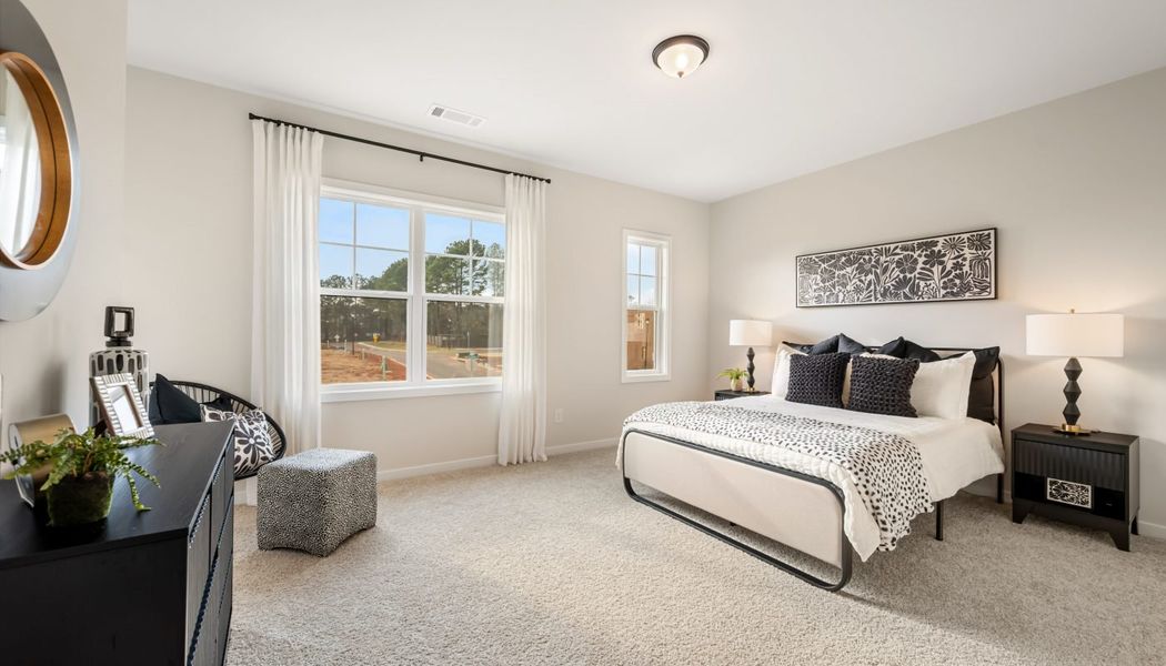 Furnished interior in a model home at Pinecrest Ridge in Dacula (Image 29).