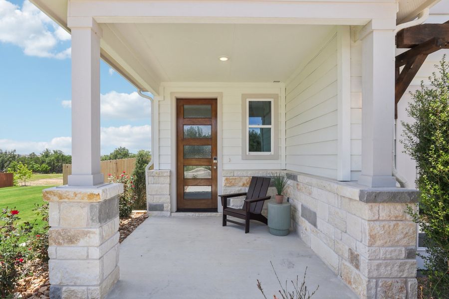 A bench in front of a house. A bench in front of a house.