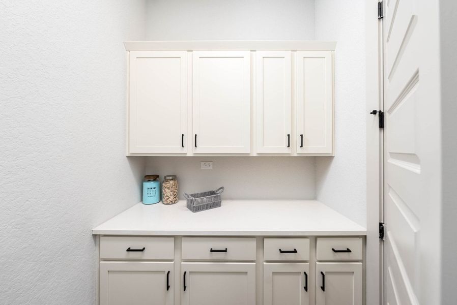 Furnished interior in a model home at Weltner Farms 60’s in New Braunfels (Image 39).