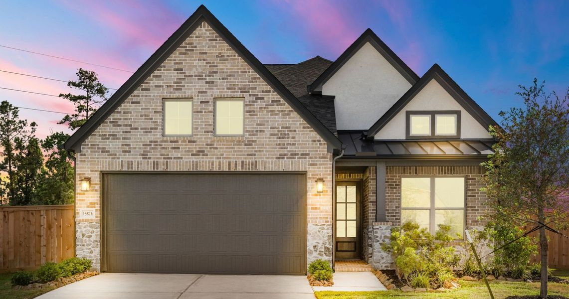 Front exterior of a home in the Sunterra community, located in Katy, TX (Image 15).