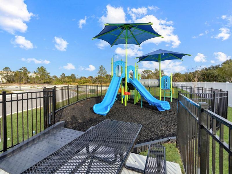 Amenities include a playground, plus a BBQ area, common areas, and ample green space.