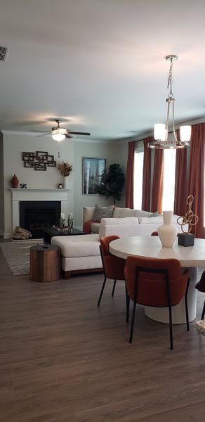 A cozy living room with a light sectional sofa, modern decor, and elegant lighting, perfect for relaxation and entertaining.