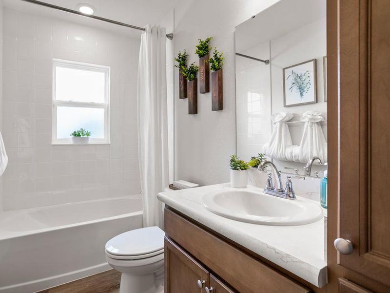 A hall bath serves the secondary bedrooms and guests - Peyton model home in Haines City, FL