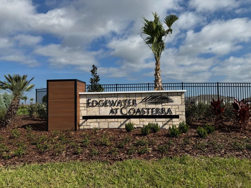 Entrance to the Coasterra community in Palmetto, FL, featuring signage and landscaping (Image 1).