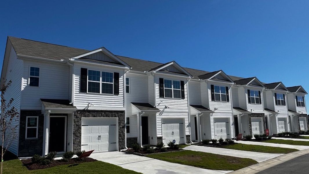 Front exterior of a home in the The Townes at Ridgewood Farms community, located in Winterville, NC (Image 16).