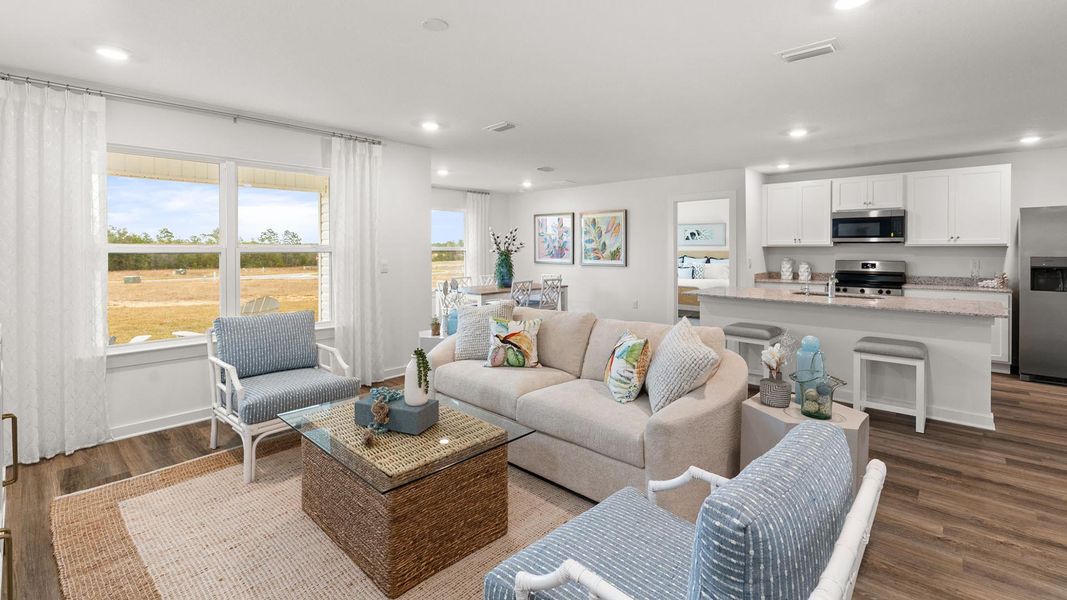 Furnished interior in a model home at Magnolia at the Bluffs Phase 3 in Freeport (Image 7).