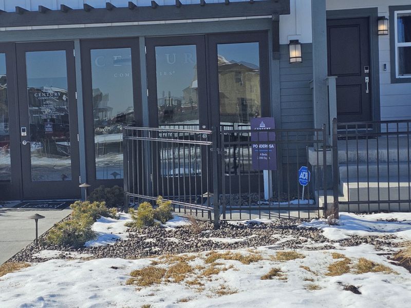 A sleek modern home with a snowy landscape in Legato by Century Communities (Commerce City, CO).
