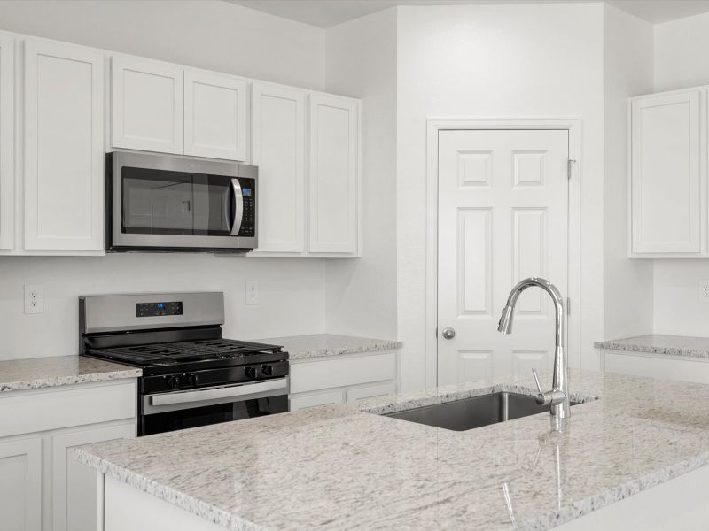 Furnished interior in a model home at Frontier Estates - The Trails Collection in Firestone (Image 16).