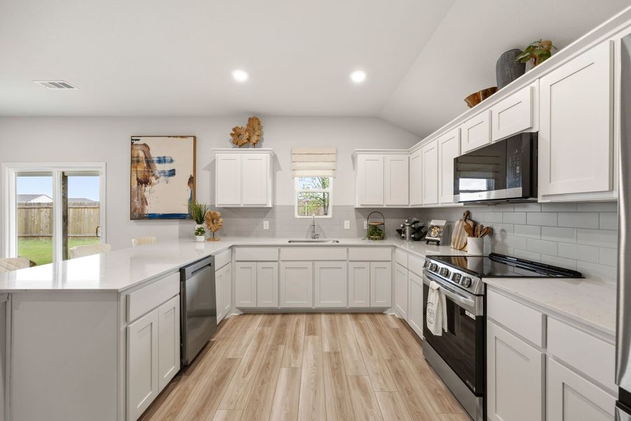 A kitchen with white cabinets. A kitchen with white cabinets.