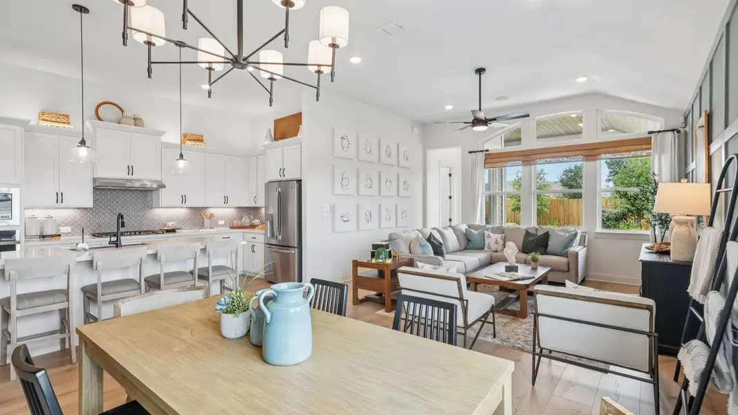 Open and airy great room seamlessly flowing into the dining area and kitchen with abundant natural light Open and airy great room seamlessly flowing into the dining area and kitchen with abundant natural light