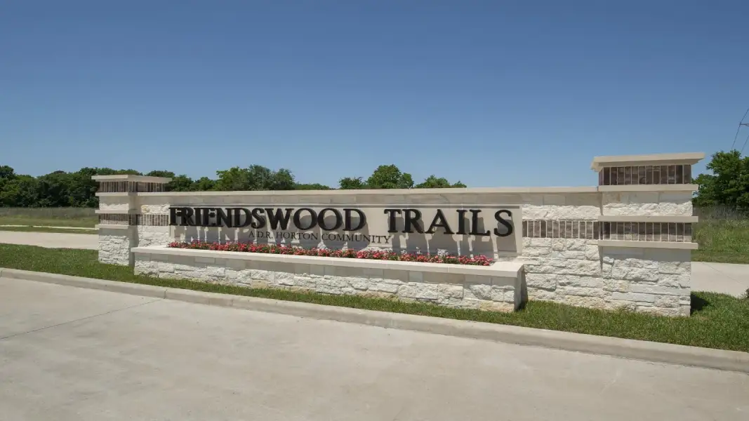 Entrance to the Friendswood Trails 60' Homesites community in Friendswood, TX, featuring signage and landscaping (Image 2).
