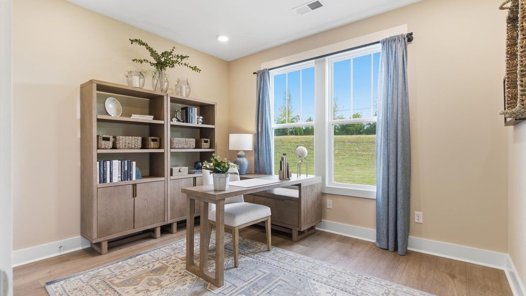 Furnished interior in a model home at Benjamin's Grove in Woodruff (Image 7).