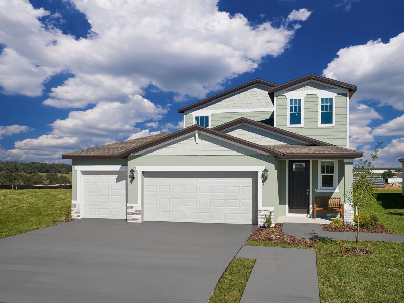 Front exterior of a home in the Benton Hills - Premier Series community, located in Brooksville, FL (Image 4).