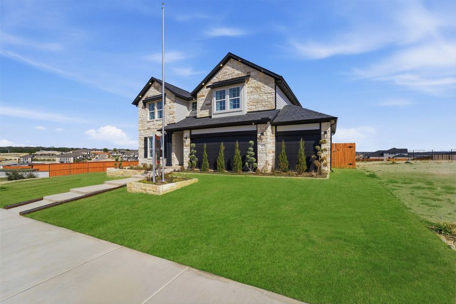 Front exterior of a home in the Lariat community, located in Liberty Hill, TX (Image 10).