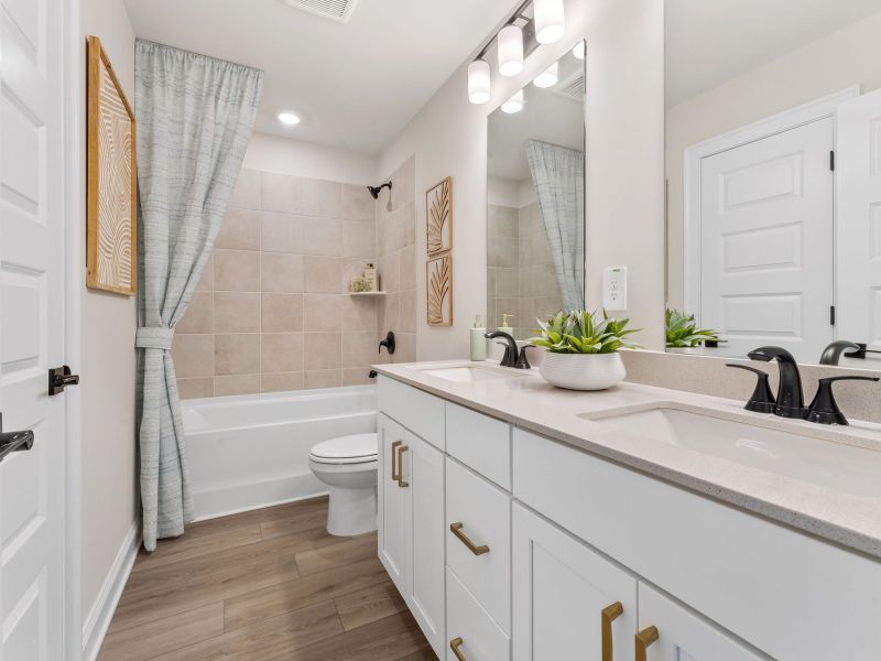 Furnished interior in a model home at Hemingway - Highland Series in Cumming (Image 27).