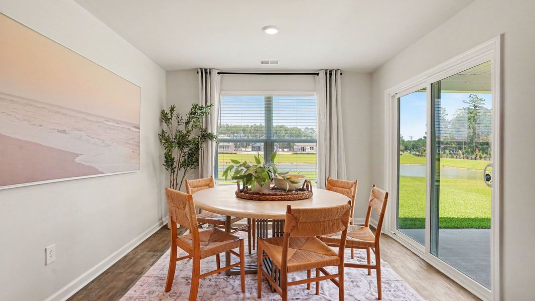 Furnished interior in a model home at Evington Place in Longs (Image 9).