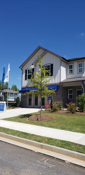 Elegant home with a brick facade and lush landscaping in Timber Ridge: Timber Ridge 42' by Lennar (Douglasville, GA).
