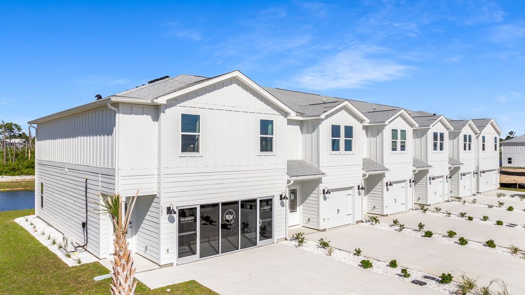 Front exterior of a home in the WindMark Townhomes community, located in Port Saint Joe, FL (Image 10).