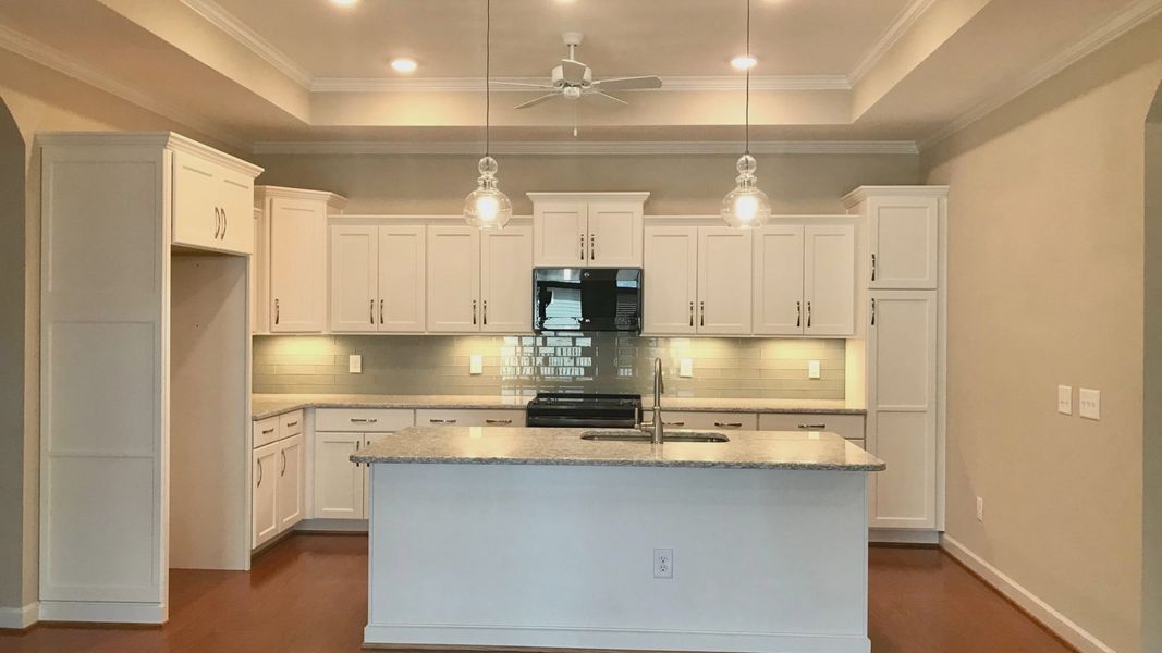 Furnished interior in a model home at Villas on 5th in Mebane (Image 7).