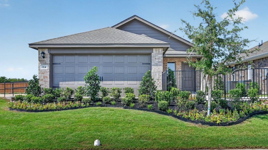 Front exterior of a home in the The Hills at Reunion community, located in Newark, TX (Image 12).