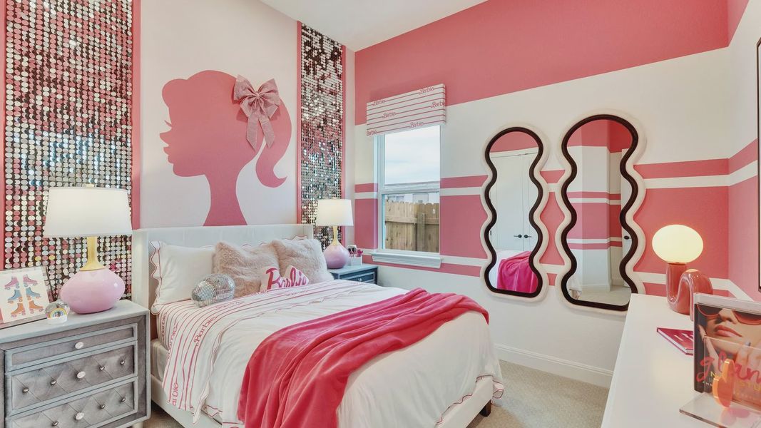 Opulent pink hues grace this bedroom with shimmering sequin walls and artistic mural in Spring Creek.