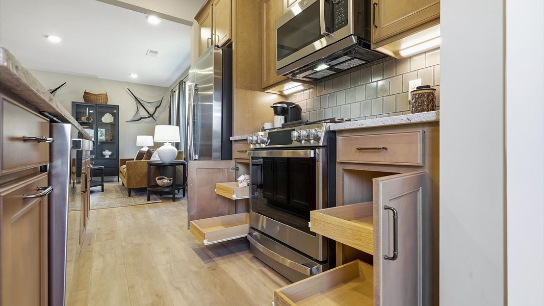 Expansive kitchen offering exceptional workspace and effortless flow to adjacent living areas at Brookland Place