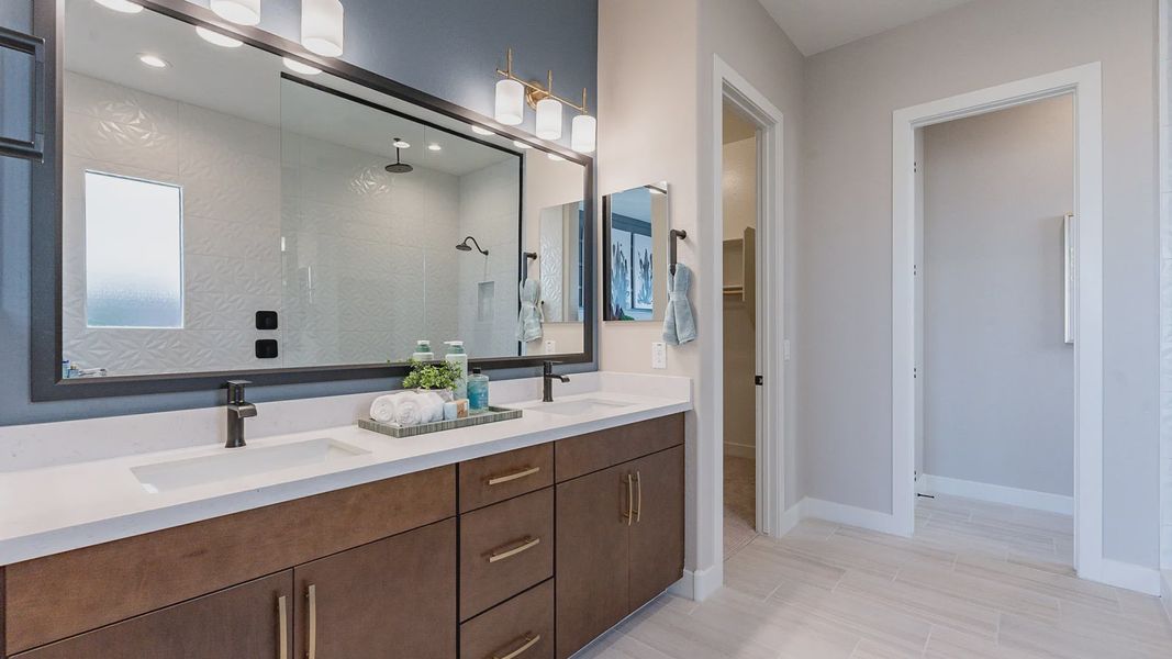 Exquisite double vanity with modern fixtures and walk-in shower in Arroyo Seco's Hacienda community. Exquisite double vanity with modern fixtures and walk-in shower in Arroyo Seco's Hacienda community.
