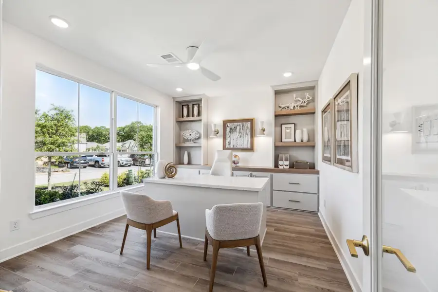 Furnished interior in a model home at The Woodlands Hills – 55' in Willis (Image 4).