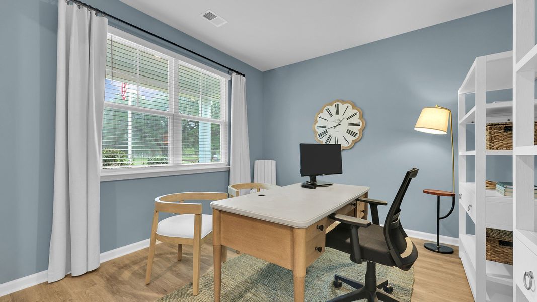 Furnished interior in a model home at The Cove at Mallard Crossing in Summerville (Image 17).