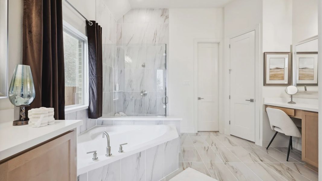 Experience opulence with stunning marble tiles, sleek fixtures, and a serene soaking tub at The Oaks.