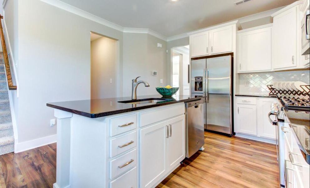 Furnished interior in a model home at CraigStone in Woodruff (Image 8).