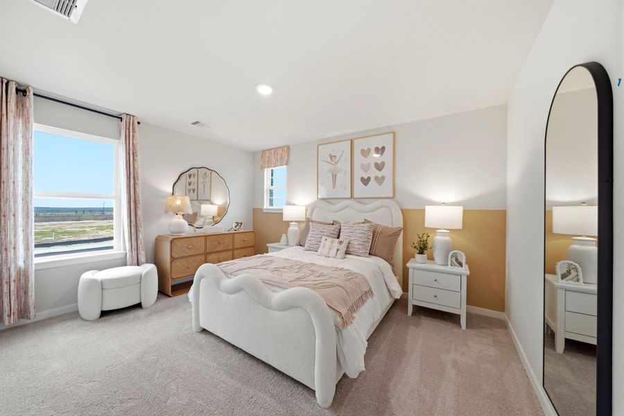 A bedroom with a large mirror. A bedroom with a large mirror.