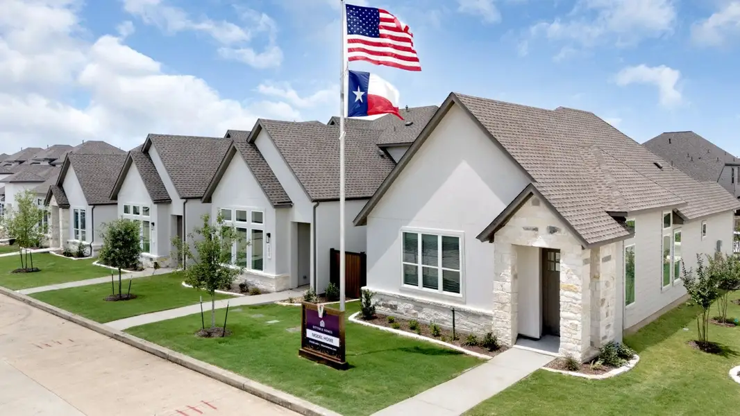 Front exterior of a home in the VIDA Townhomes community, located in San Antonio, TX (Image 1).