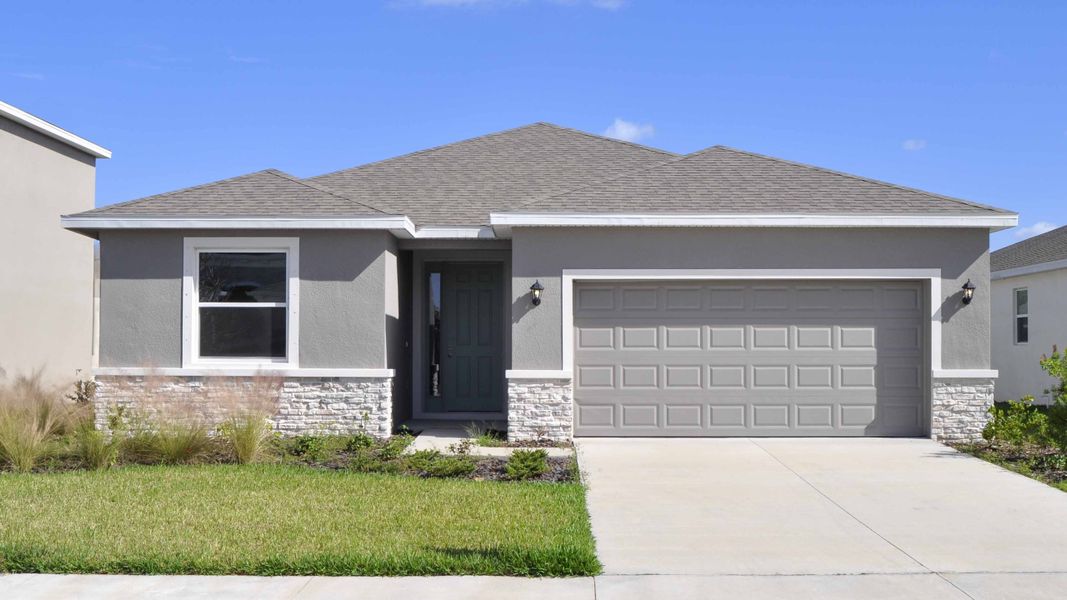 Front exterior of a home in the Oakfield Trails community, located in Parrish, FL (Image 9).
