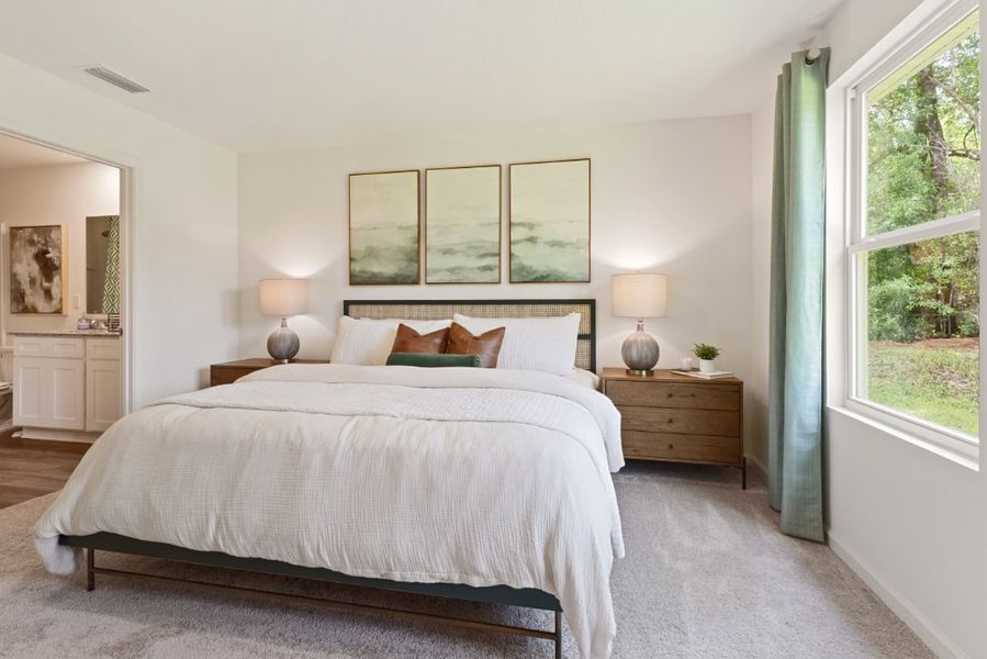 A bedroom with a large bed.