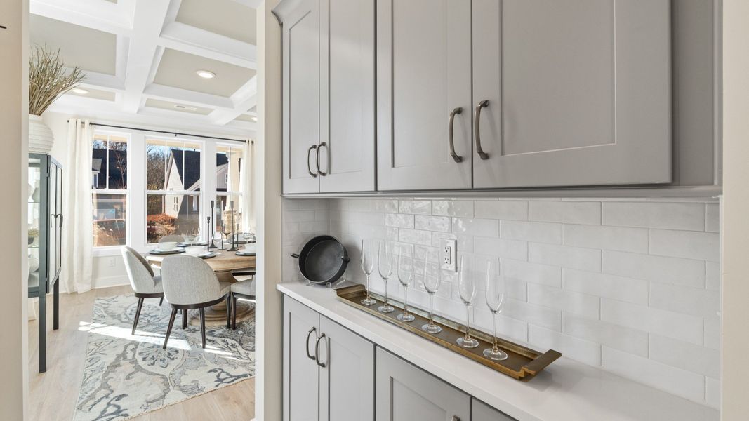 First-class finishes and a thoughtful butler's pantry highlight this elegant kitchen space First-class finishes and a thoughtful butler's pantry highlight this elegant kitchen space