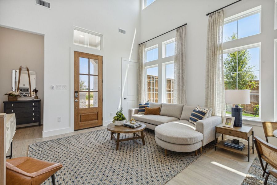 Furnished interior in a model home at Newman Village Townhomes in Frisco (Image 6).