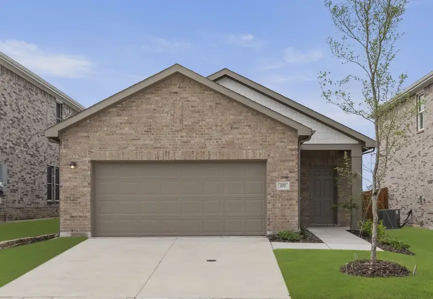 Front exterior of a home in the Windmill Farms community, located in Forney, TX (Image 12).